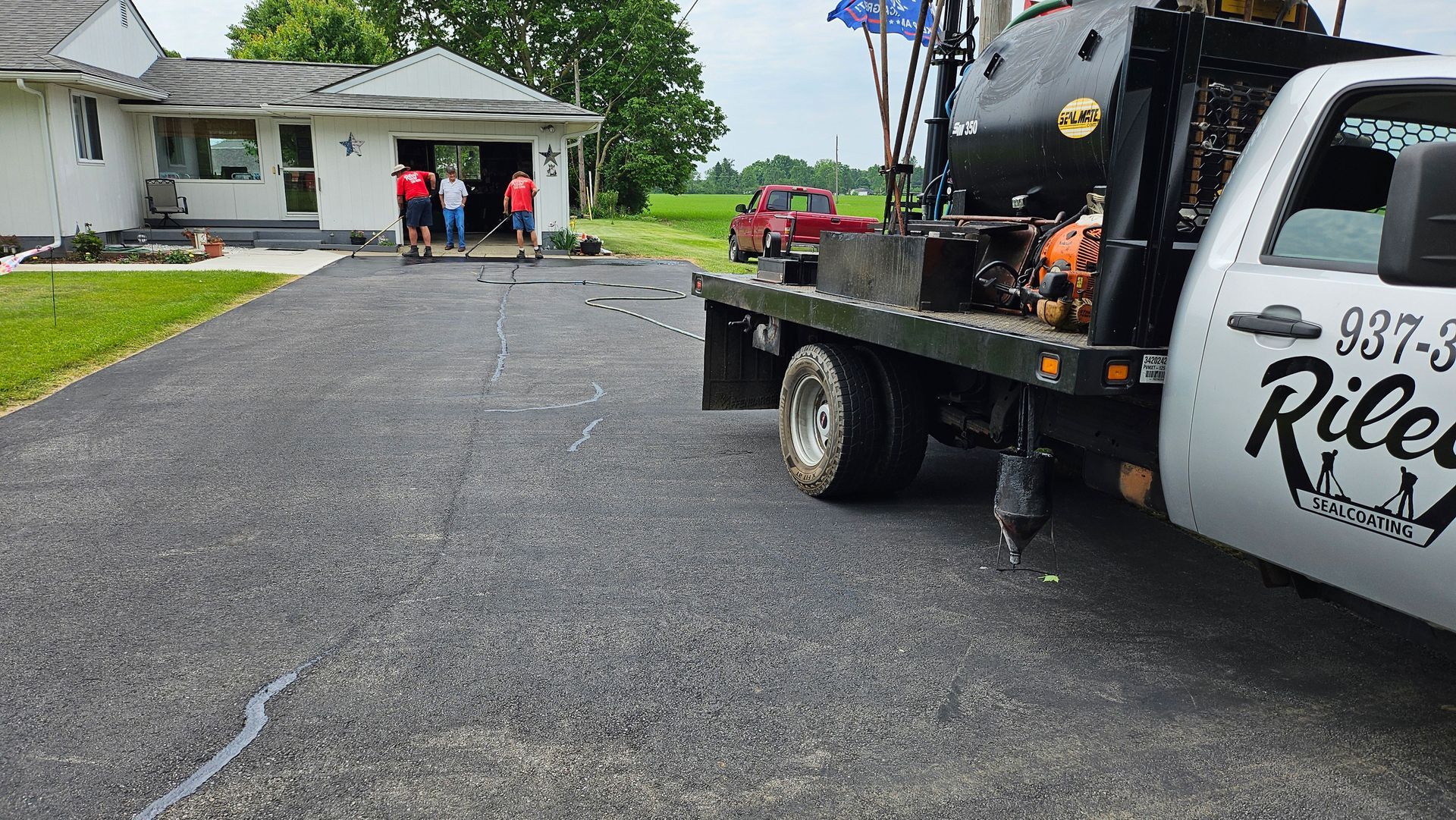 A tow truck is parked in front of a house
