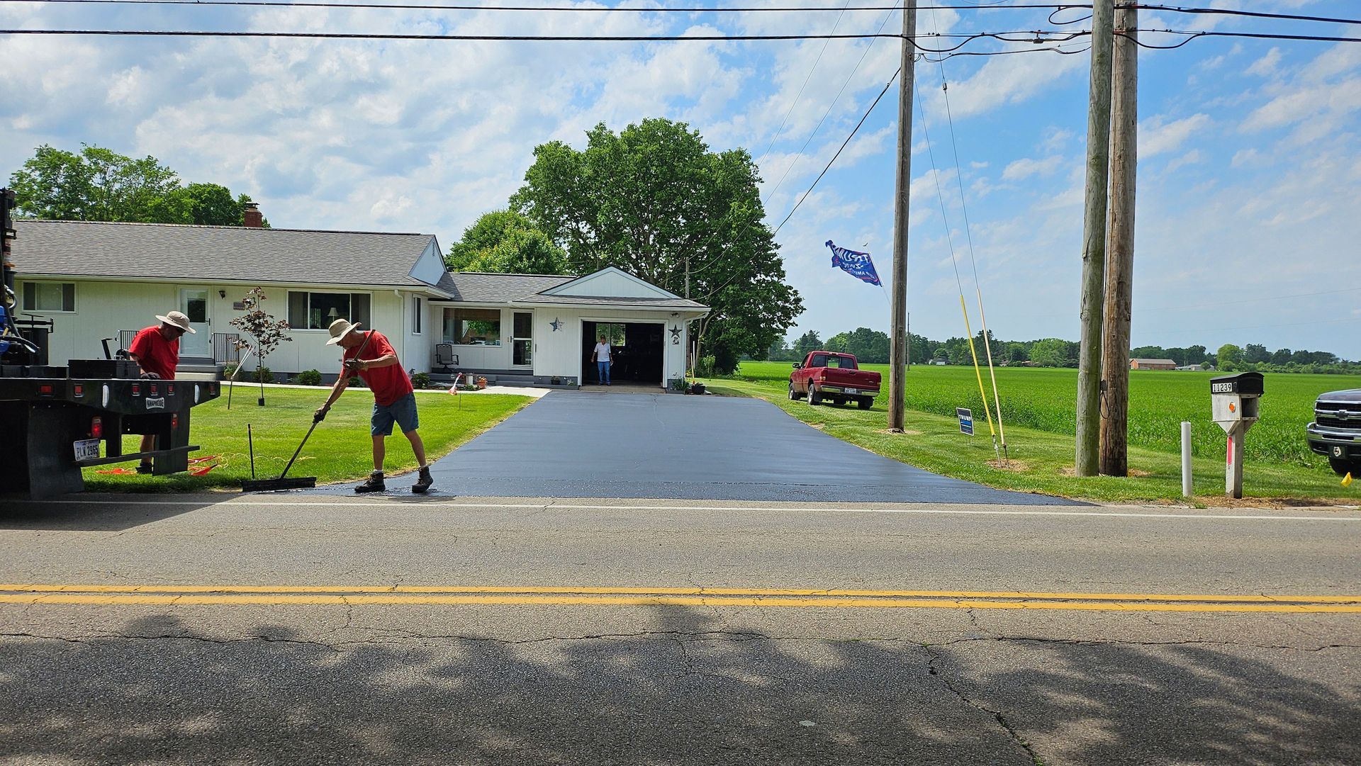A picture of a house and a road that has been paved