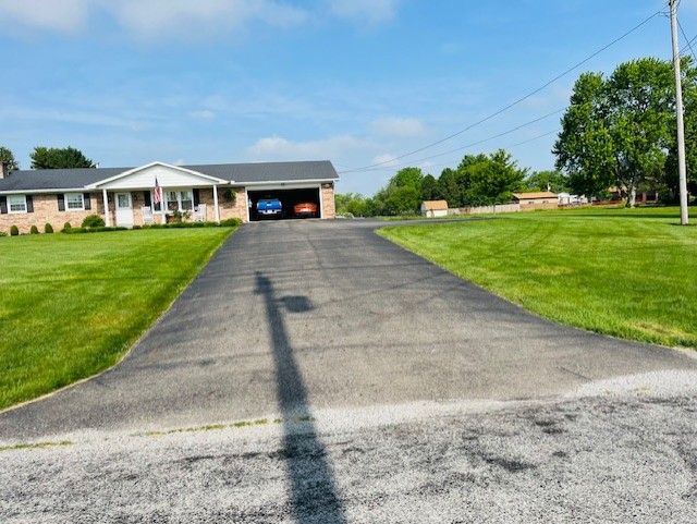 A picture of a driveway before being re-paved