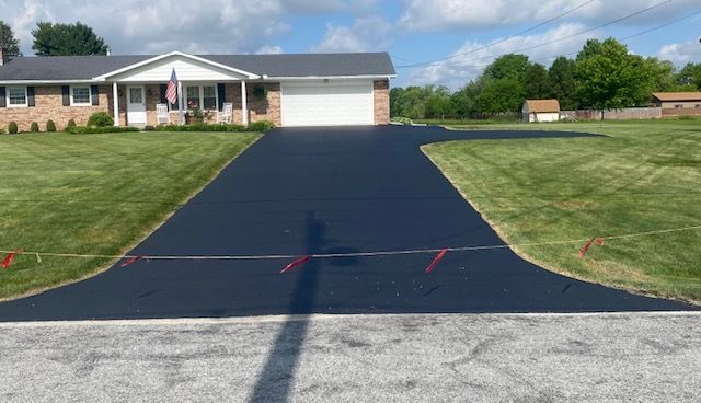 A picture of a driveway after being re-paved