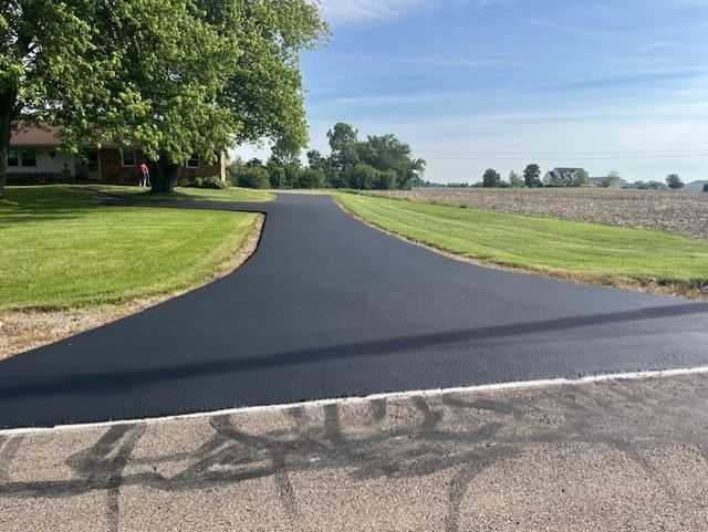 A picture of a driveway after paving