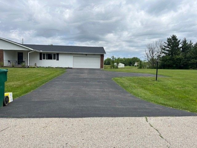 A photo of a driveway before paving