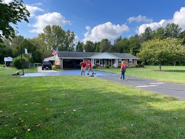 Sealcoating in front of a house