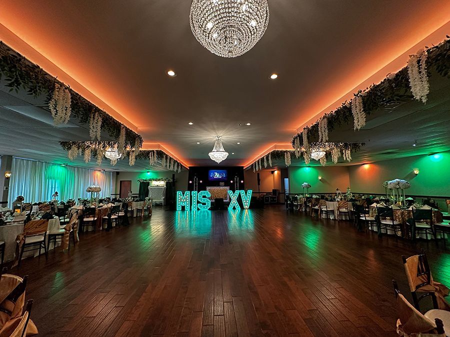 Elegant ballroom with tables set for an event, 