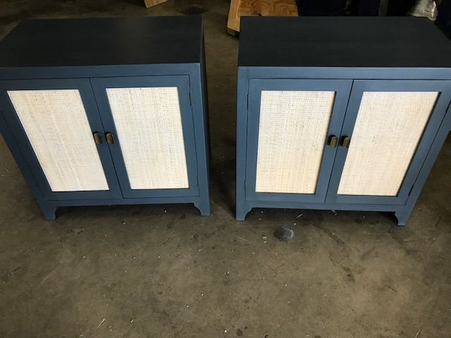Two blue cabinets with wicker doors are sitting next to each other