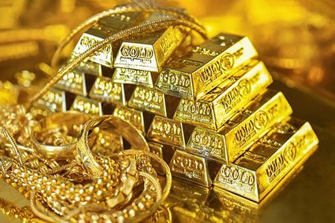 A pile of gold bars stacked on top of each other on a table.