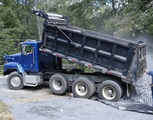 Truck dumping gravel