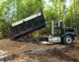 Truck dumping sand