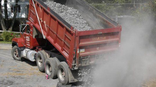 Truck dumping gravel