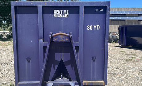 A dumpster with the words RENT ME