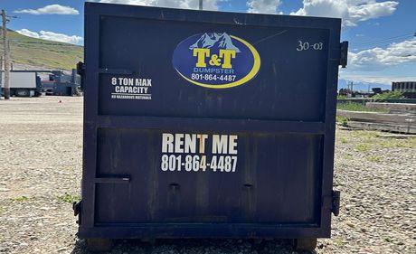 A dumpster with the words RENT ME