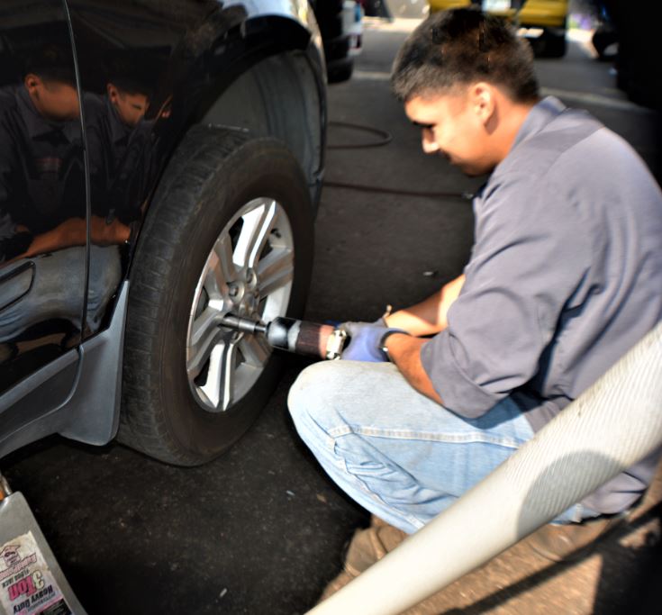 Man Fixing Tires