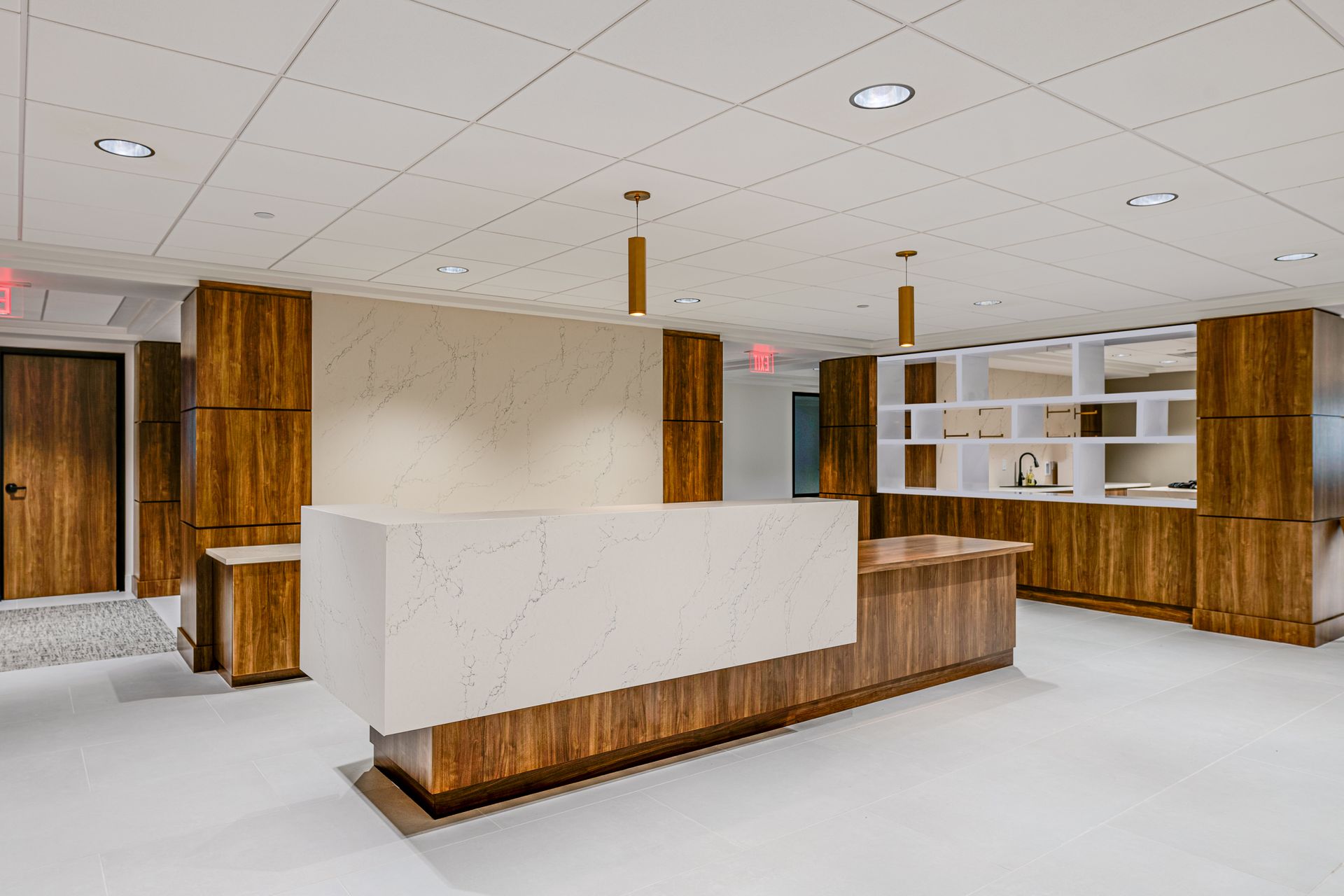 There is a large white counter in the middle of the room.