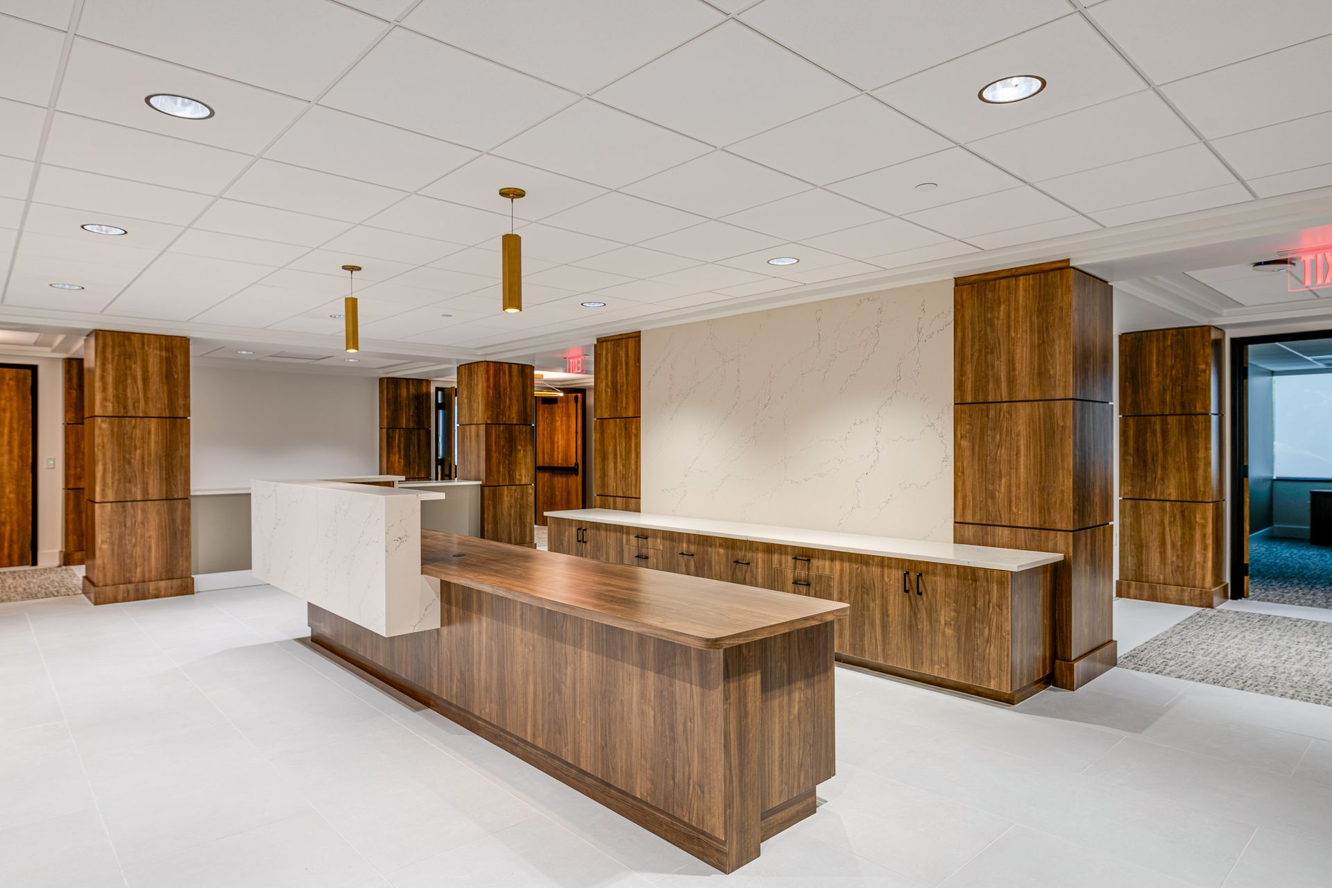 There is a large wooden counter in the middle of the room.