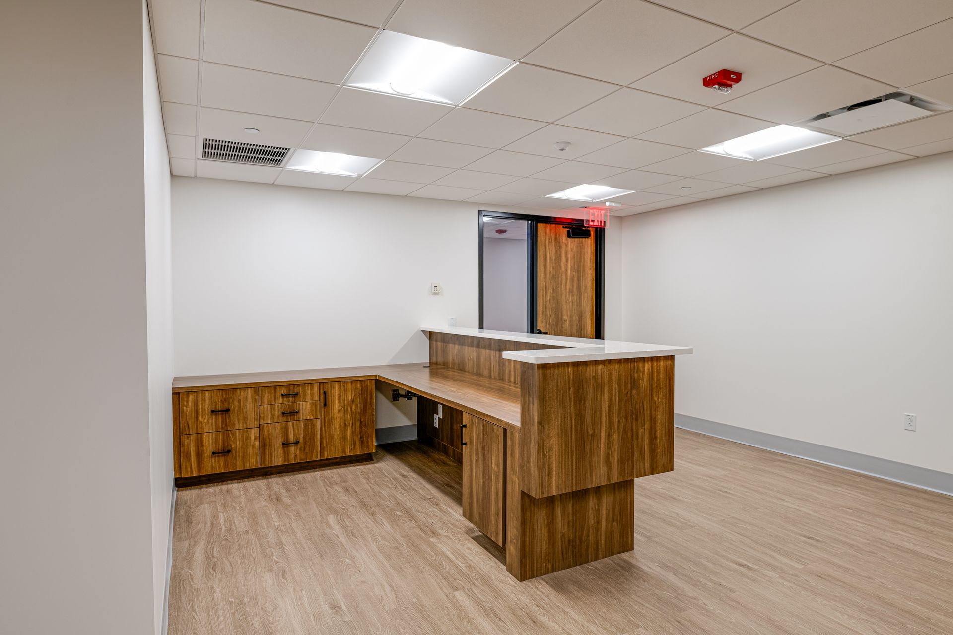 There is a wooden counter in the middle of the room.