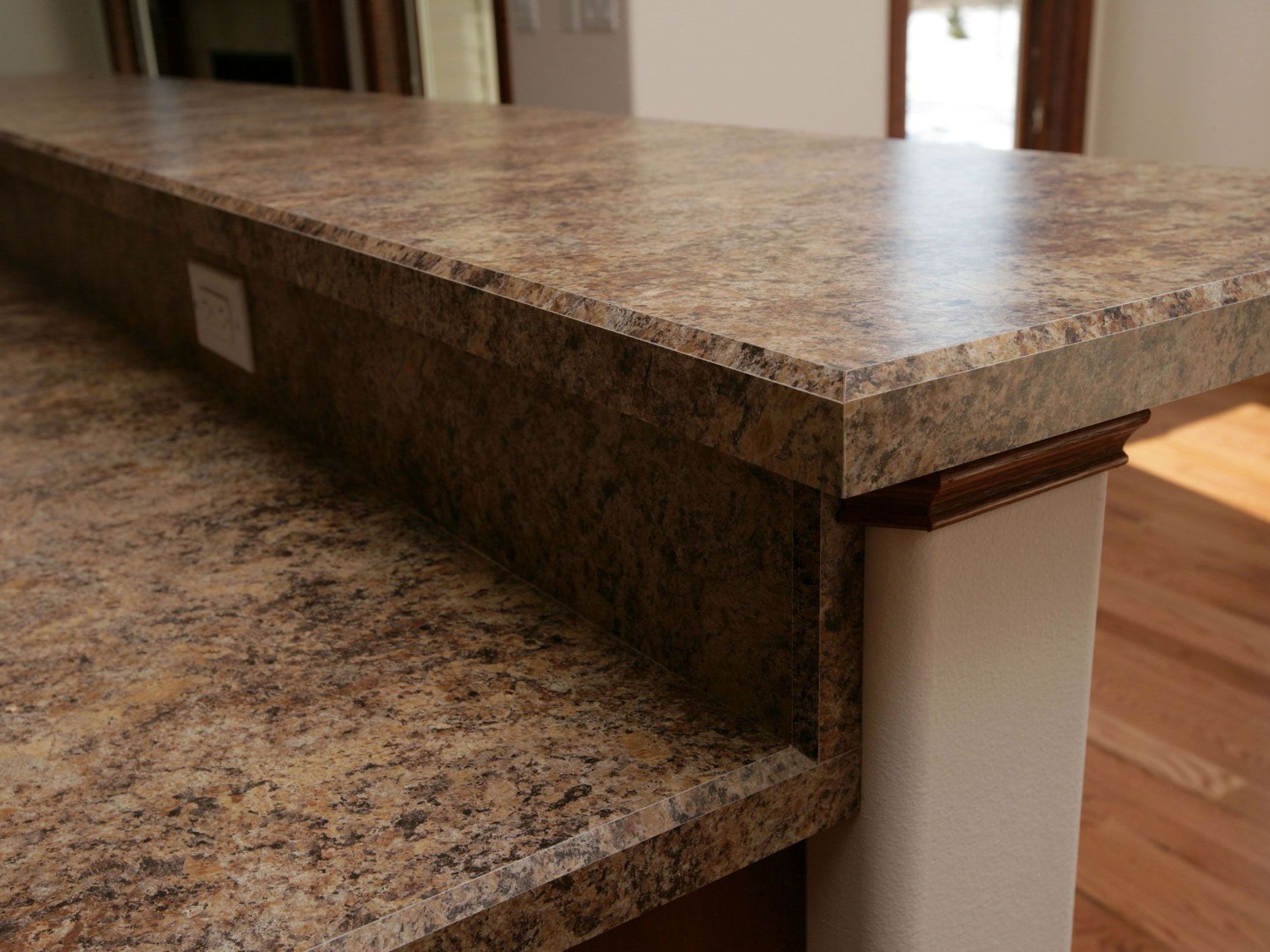 A close up of a granite counter top in a kitchen