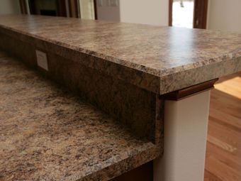 A close up of a granite counter top in a kitchen