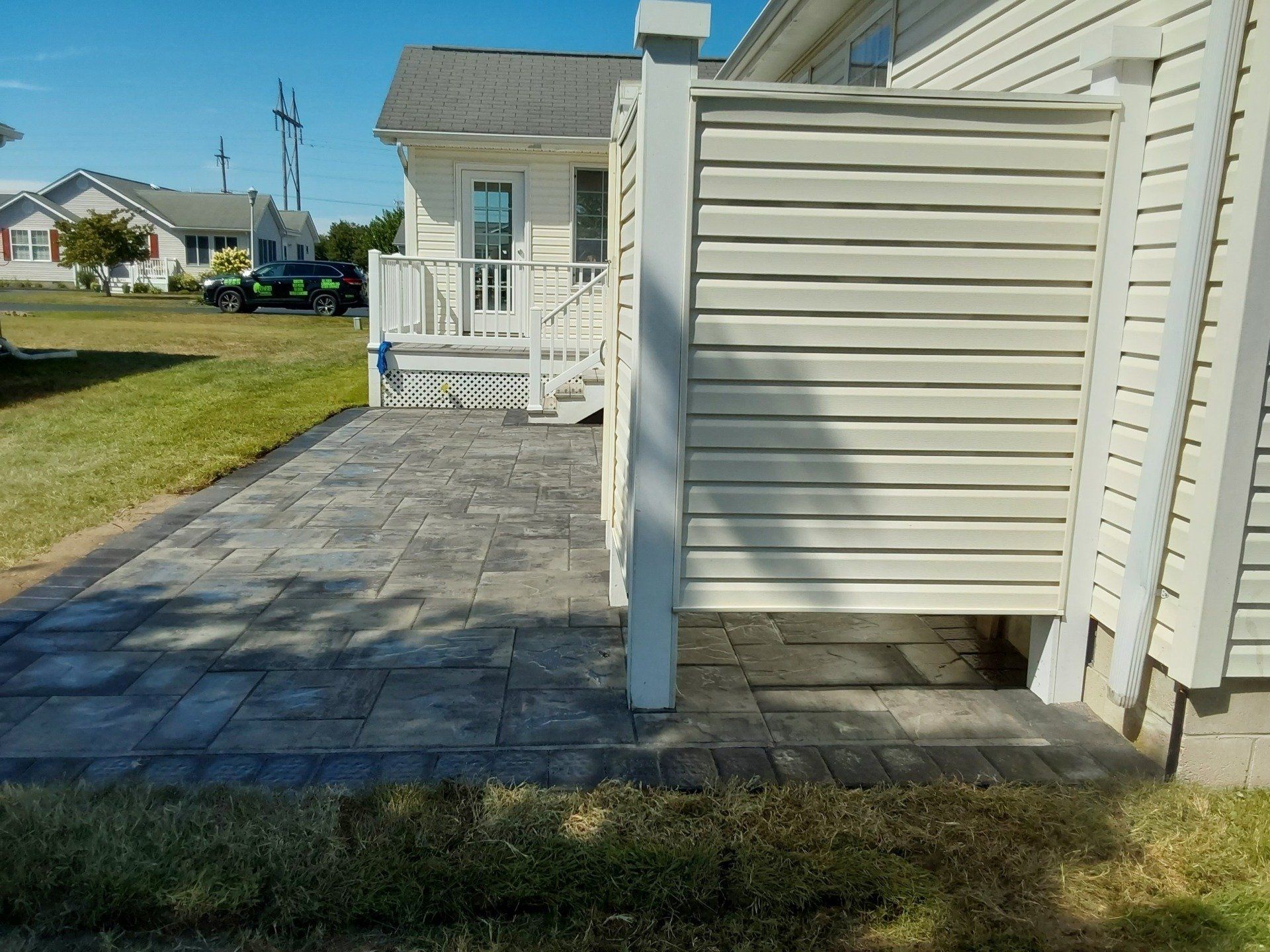 A white house with a walkway leading to it