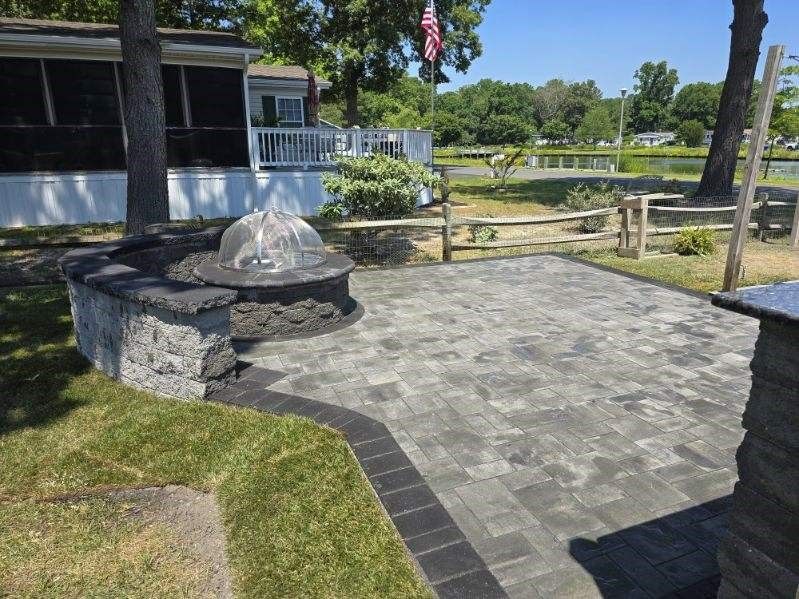 There is a fountain in the middle of the patio.