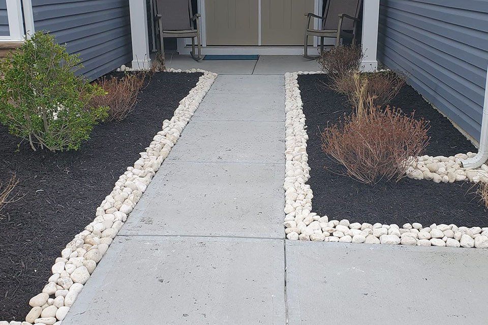 A walkway leading to the front door of a house