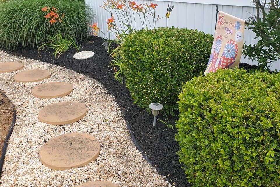 There is a flag in the middle of the garden.