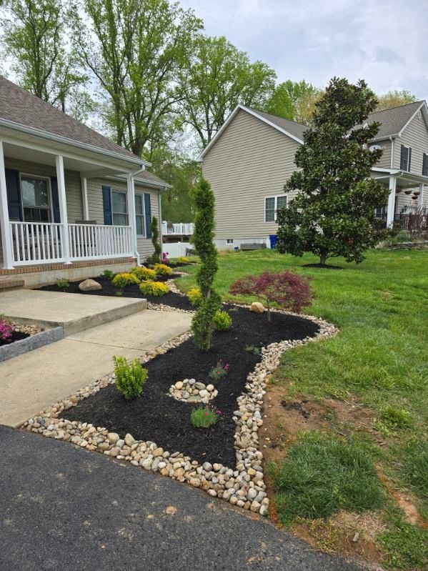 A house with a lush green lawn and a walkway in front of it.