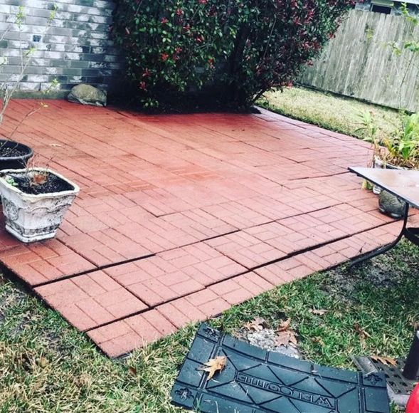 A clean concrete patio after pressure washing