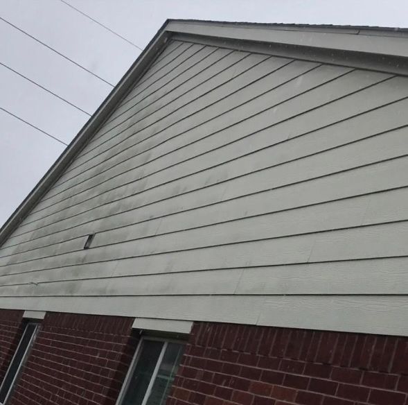 A dirty white siding of a building