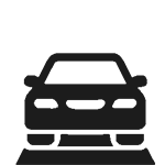 A black and white silhouette of a car on a road.