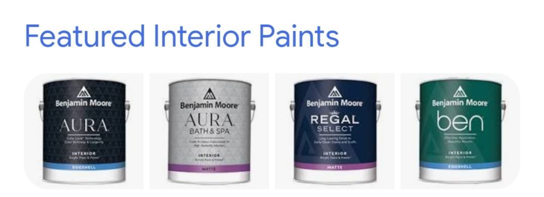 Four cans of paint are sitting next to each other on a white background.