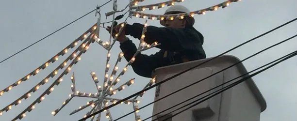 Man installing lights
