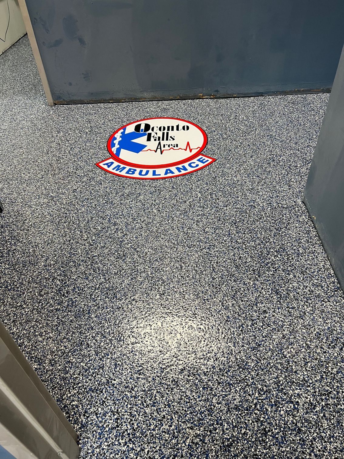 Floor with speckled pattern, red, white, and blue 