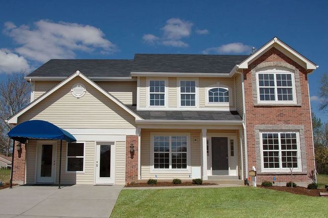 Two-story suburban house with beige siding, red brick, and a blue awning over the front door