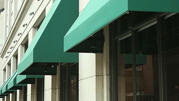 Green awnings on commercial windows