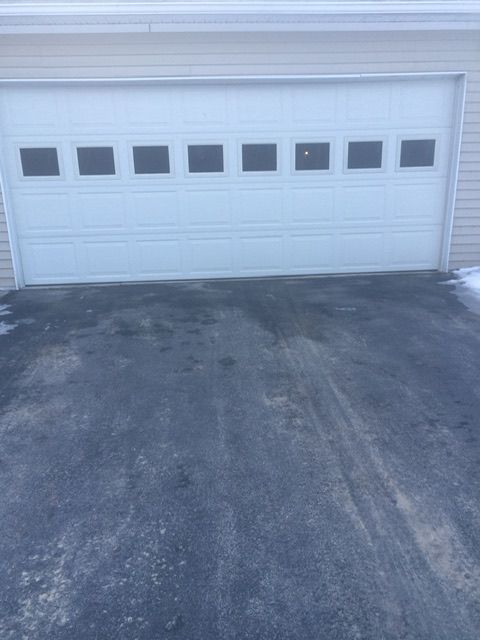 two garage spaces and concrete floor driveway