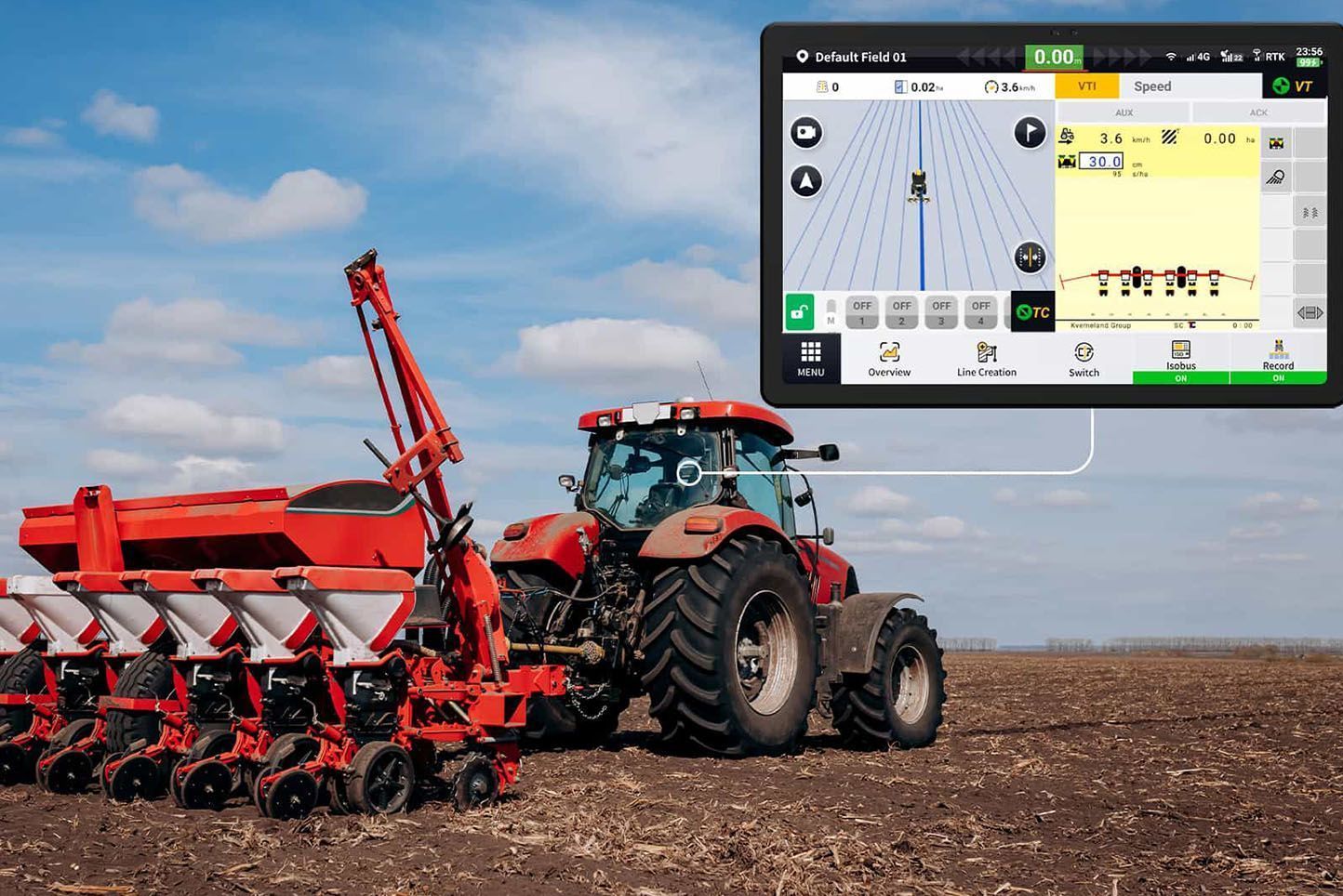 Red tractor pulling a seeder across a field, with a monitor displaying planting data.