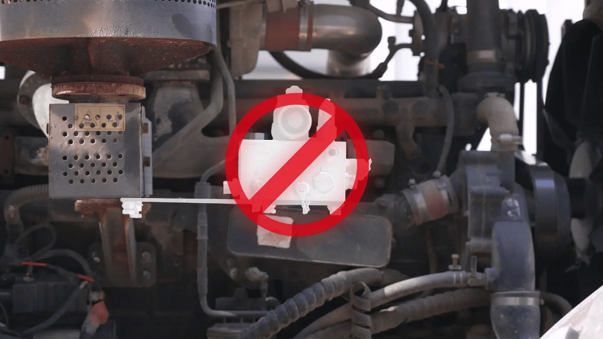 Engine with component crossed out in red.