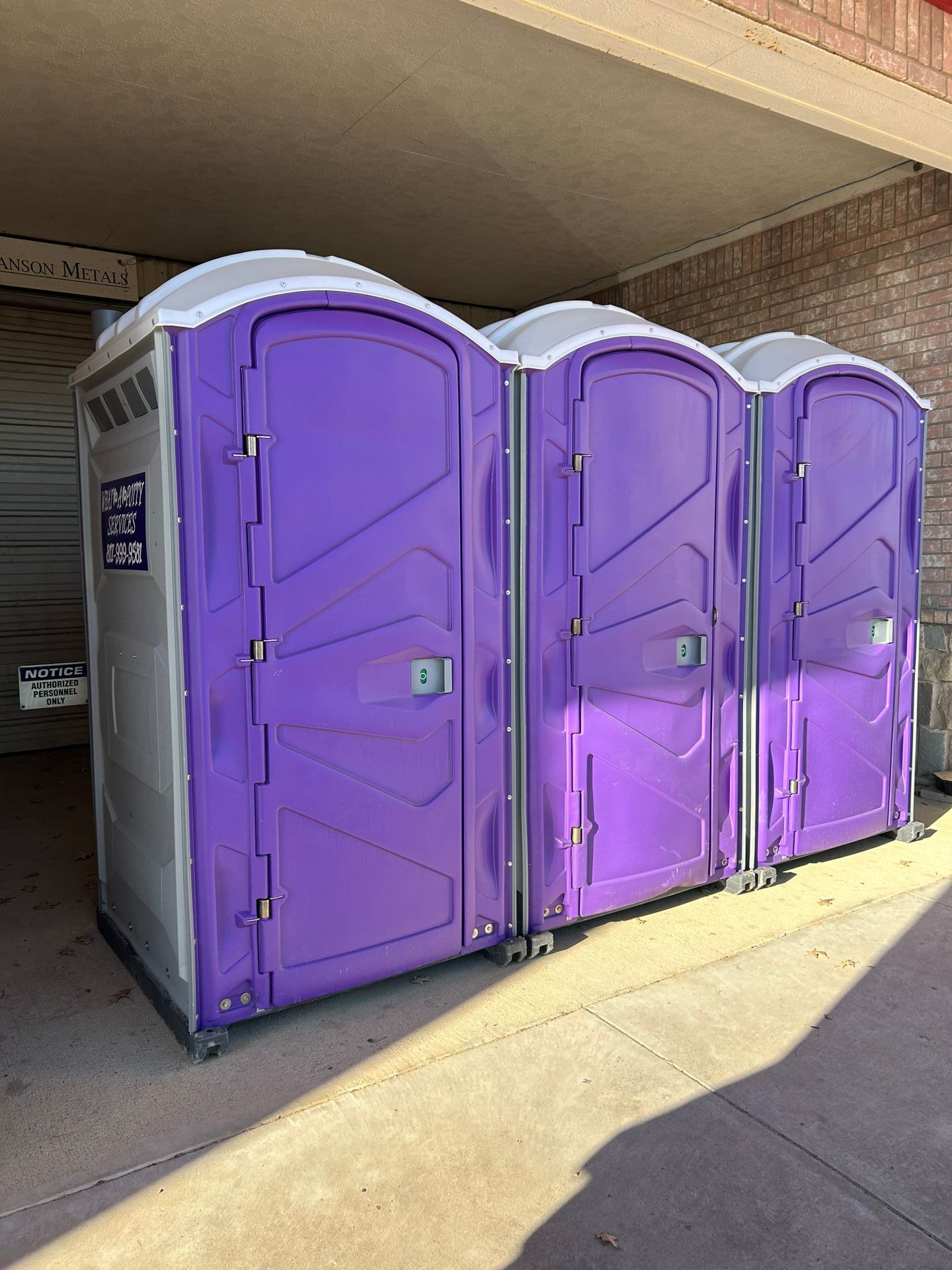 Purple portable toilets