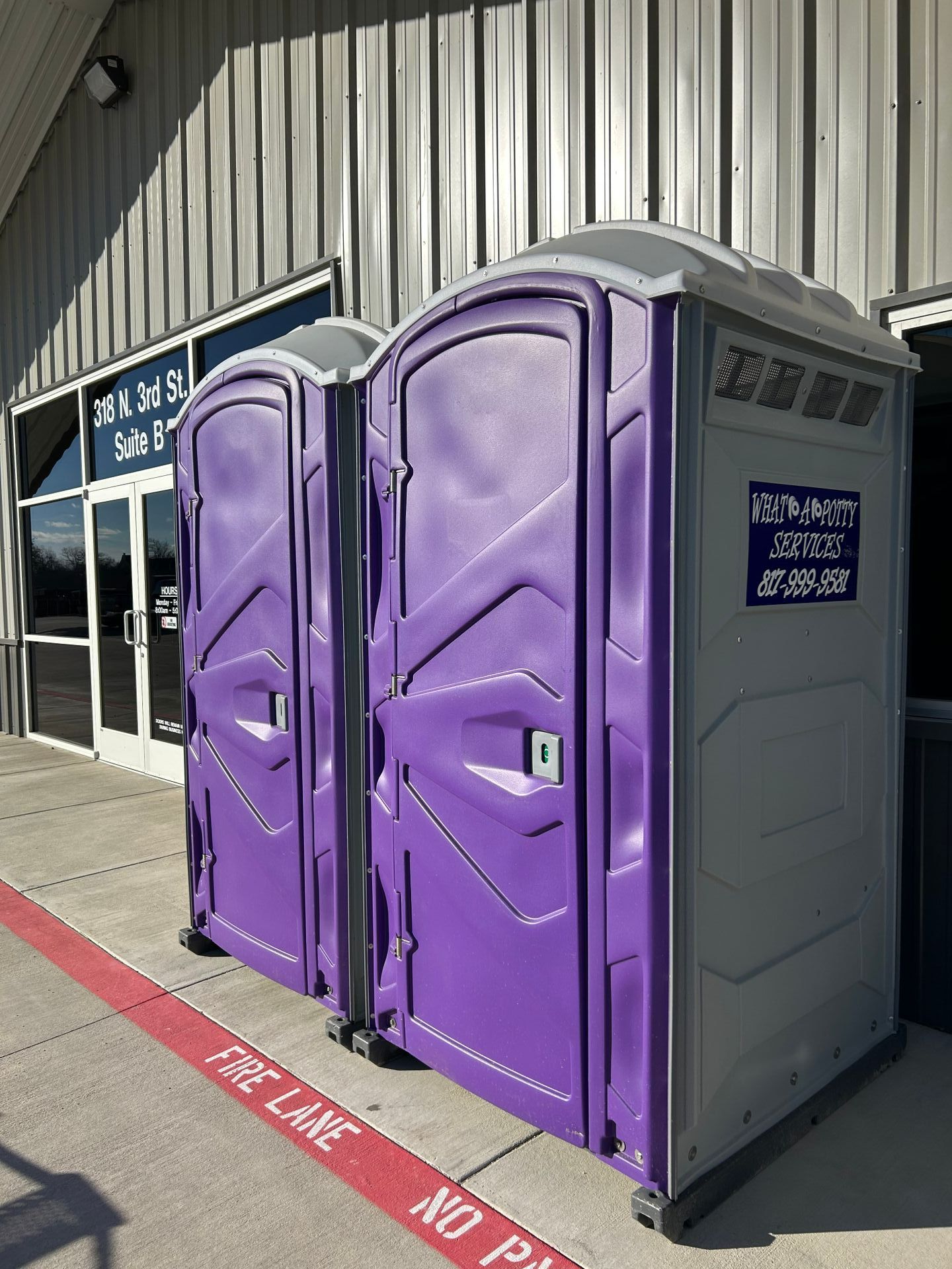 Purple portable restrooms