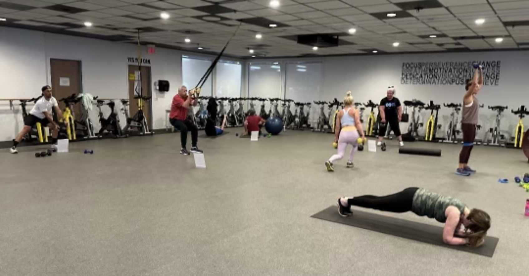 People Exercising Cycling Room