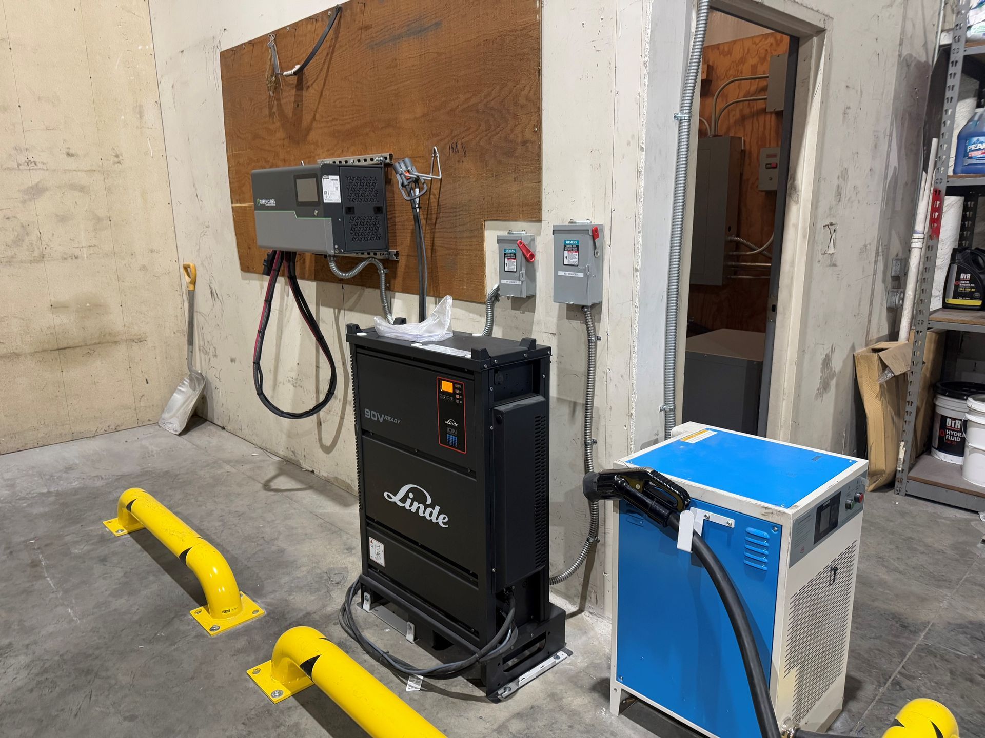 A warehouse with a blue box and a black box.