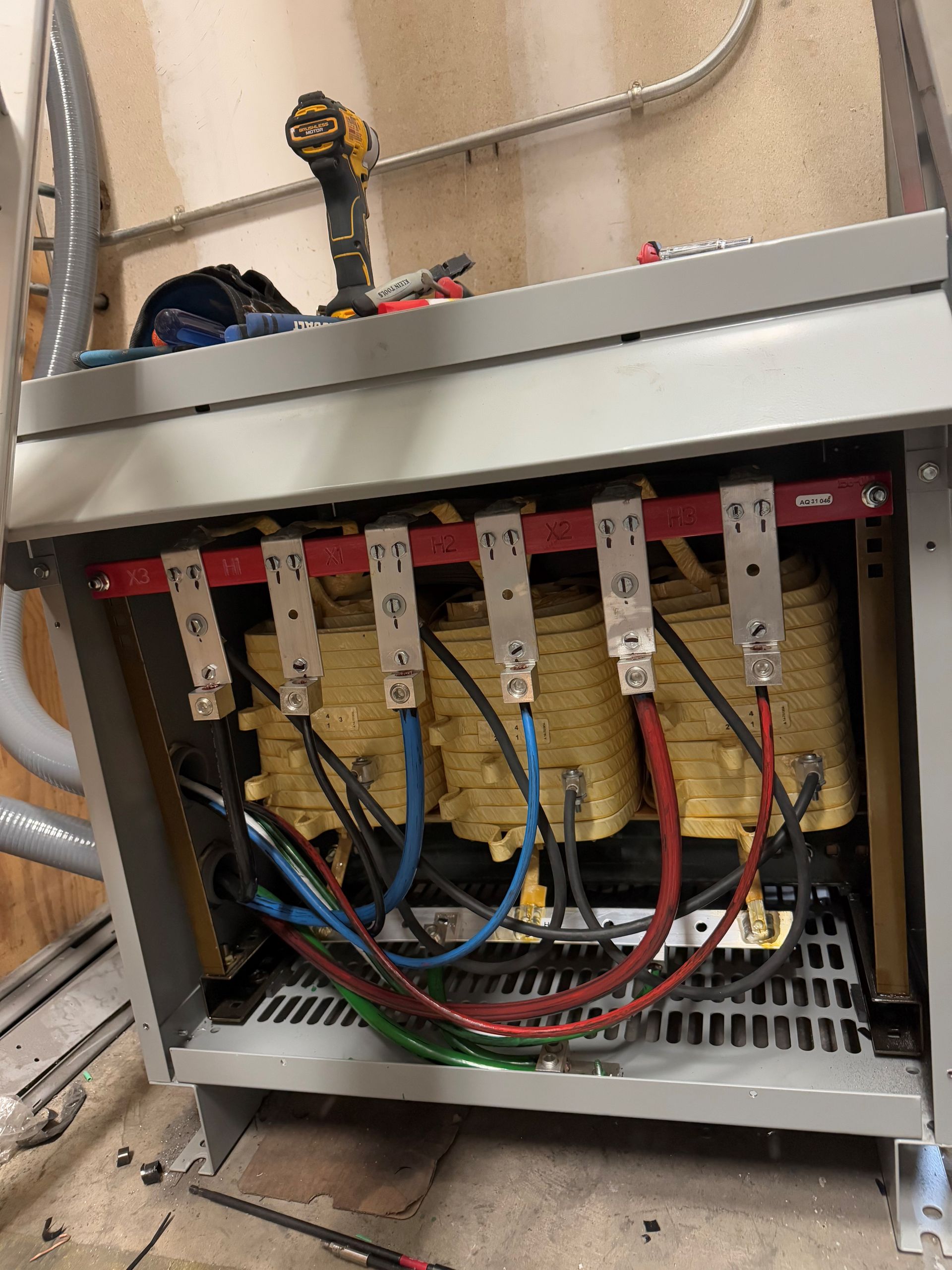 A bunch of wires are connected to a transformer.