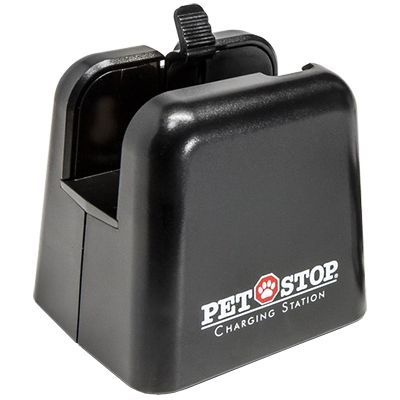 A black Pet Stop charging station for pet containment collars.