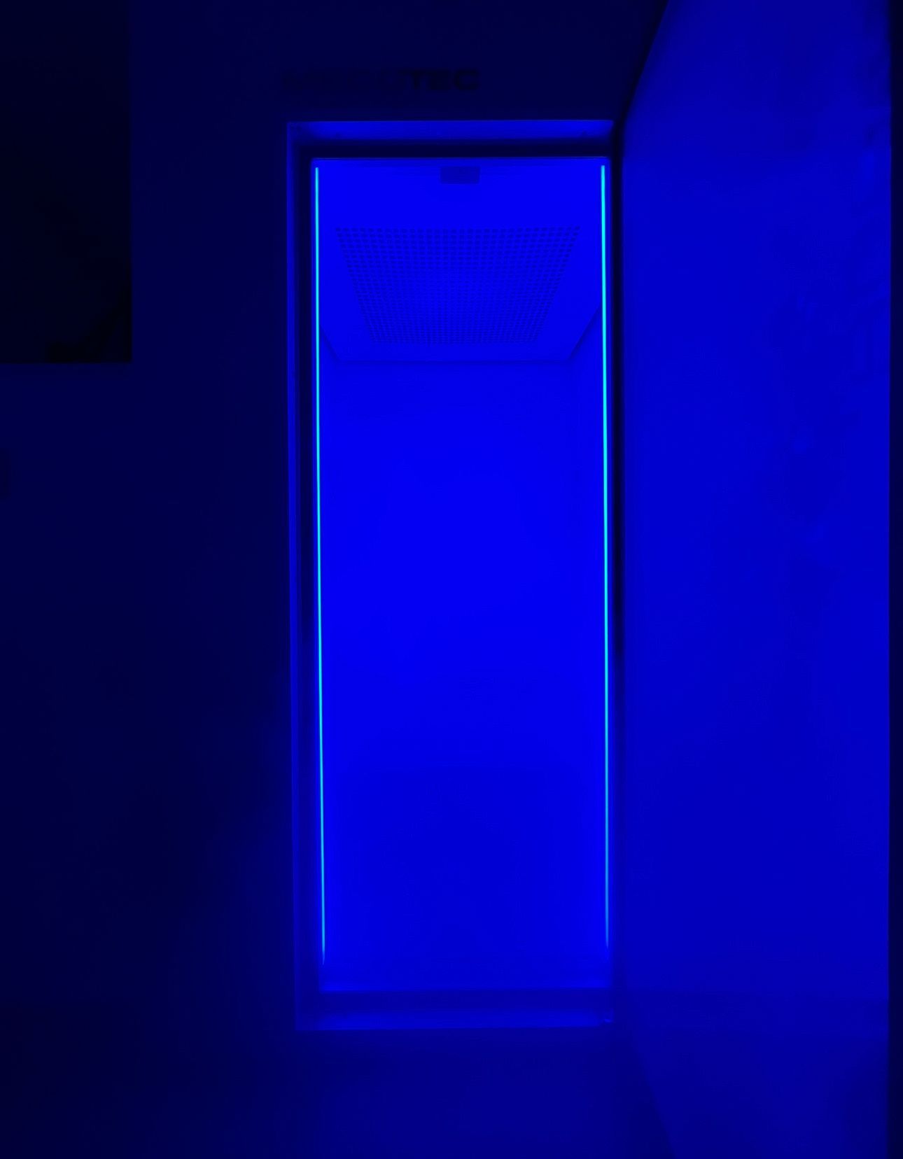 Blue light illuminating a rectangular window. Dark walls surround the window.