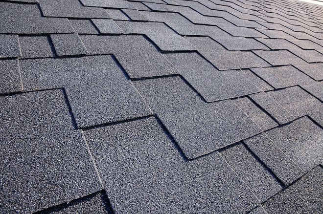 Dark gray asphalt shingle roof, angled view.