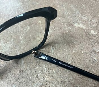 a pair of glasses with a broken frame