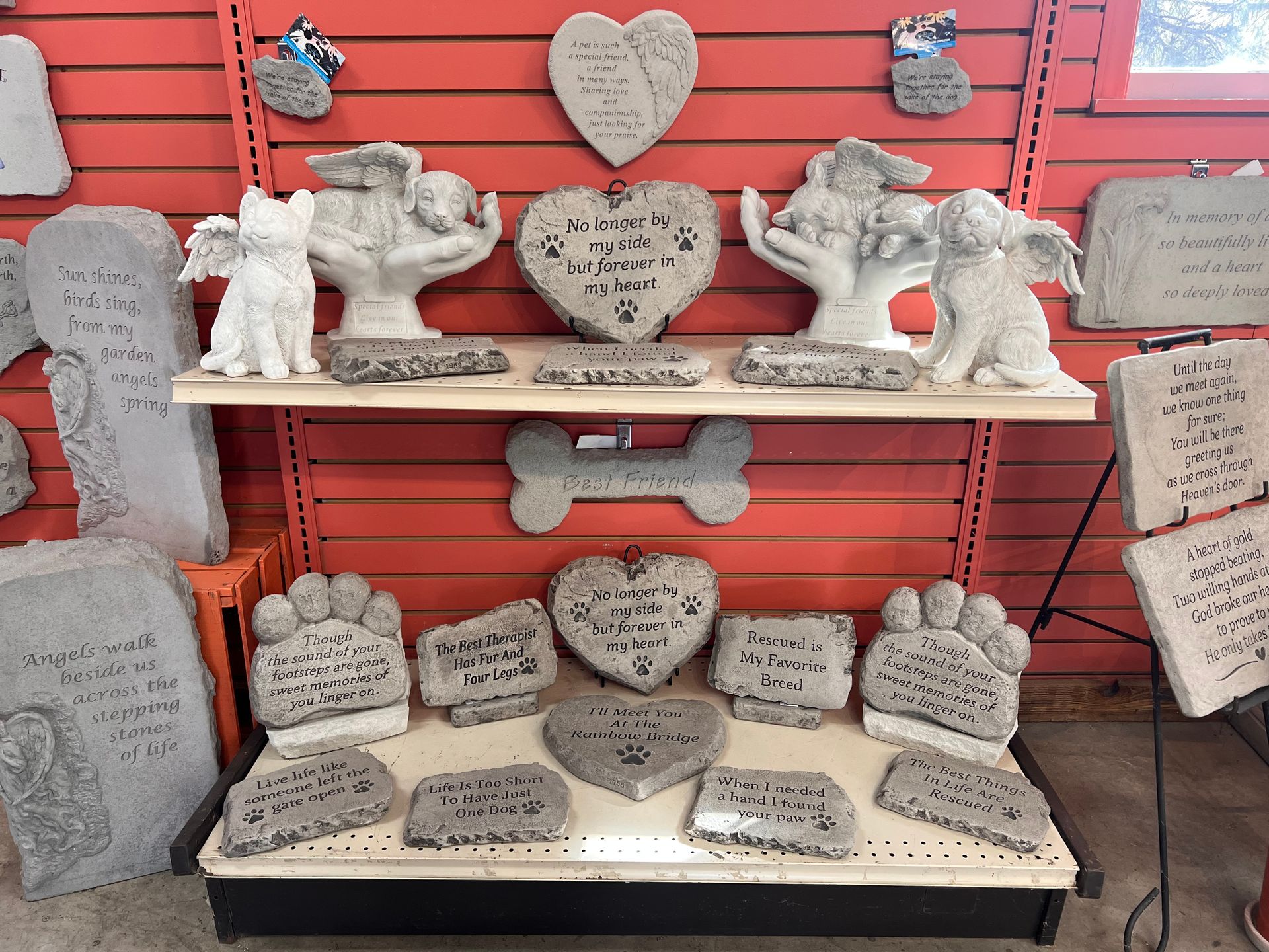 A display of memorial stones for dogs and cats in a store.