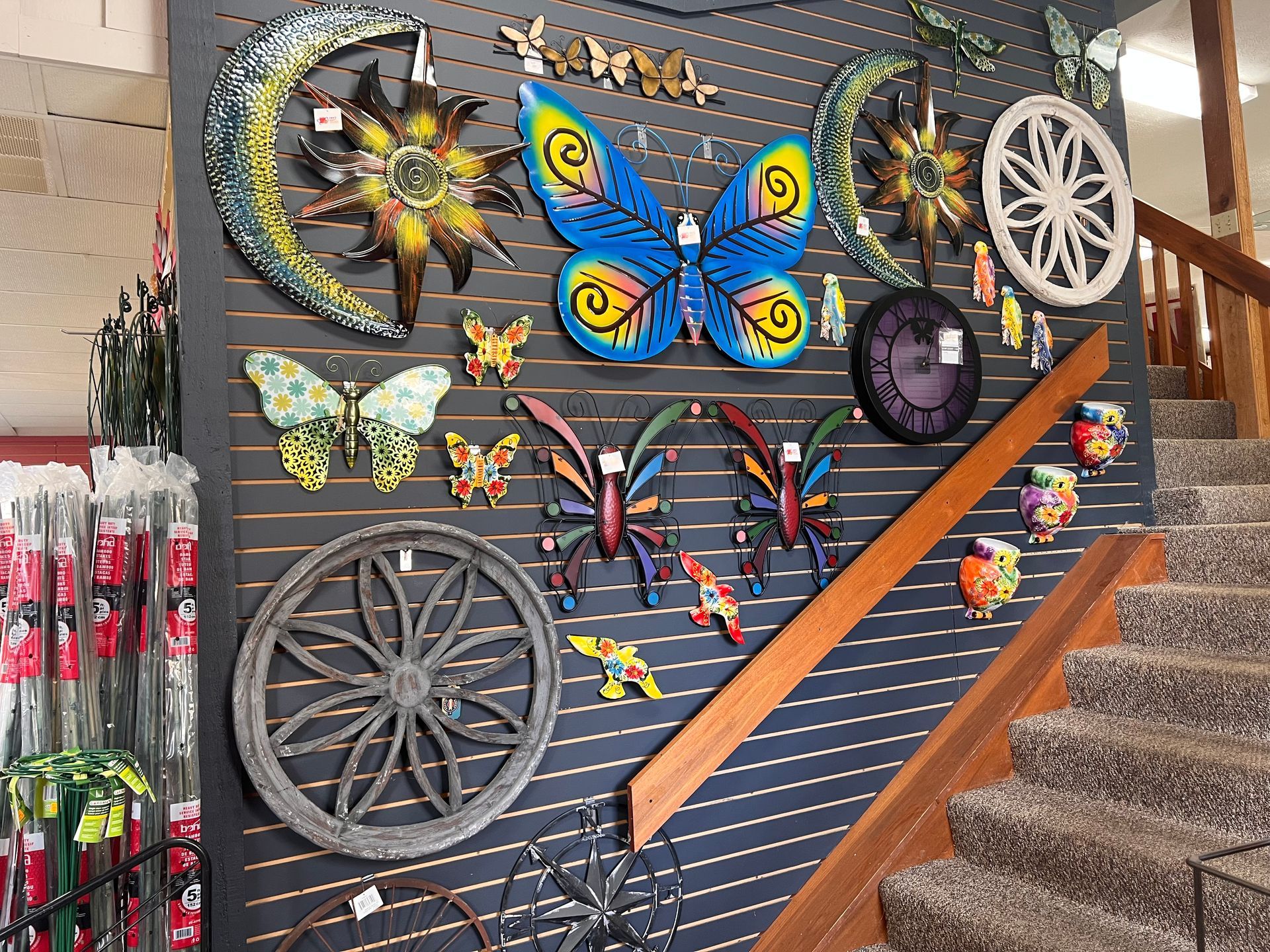 A wall with a butterfly and a crescent moon on it