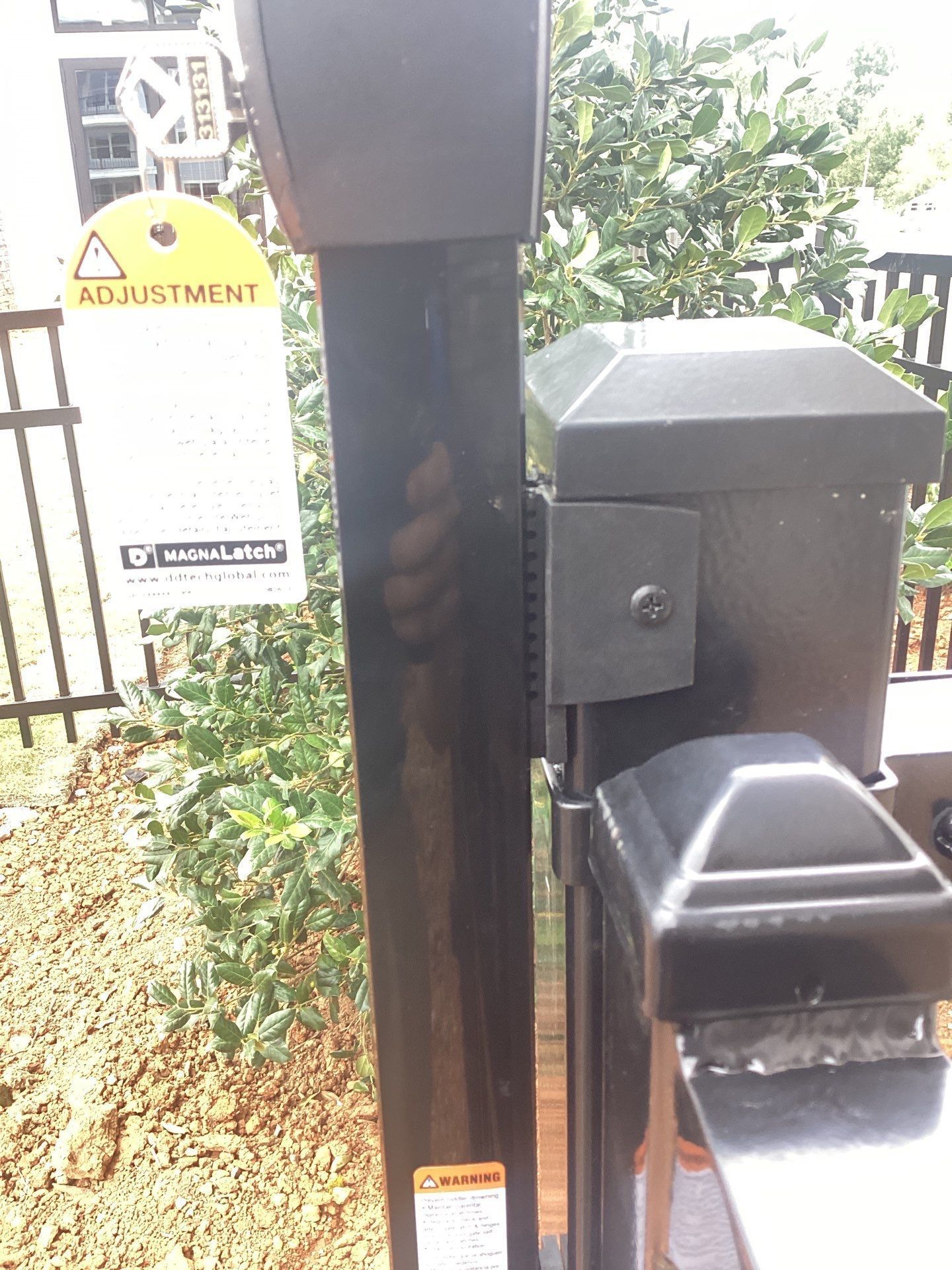 Black metal gate post with latch and 