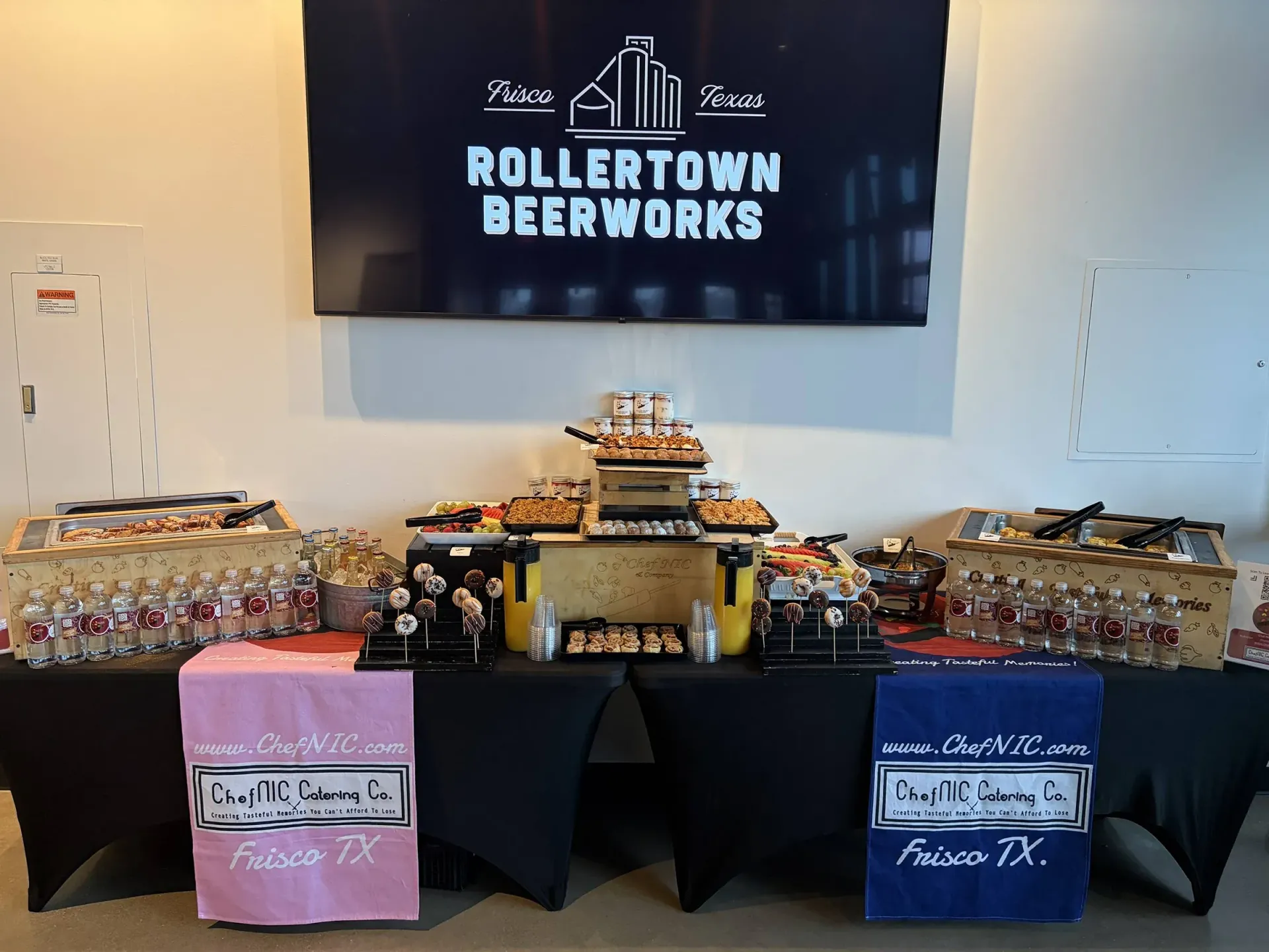 Catering table with food and drinks; 